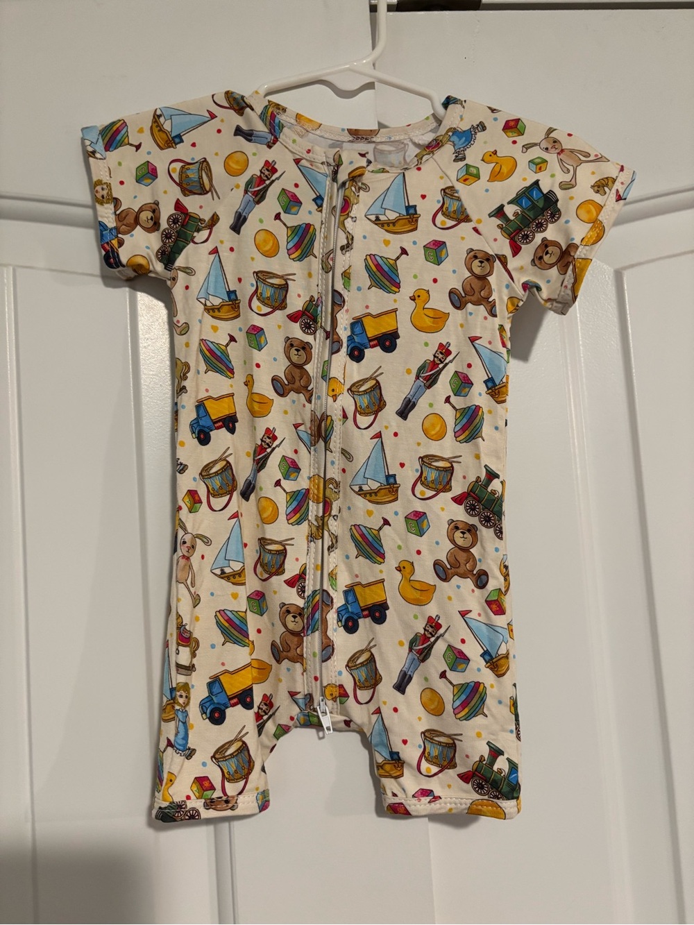 Kids Short Sleeve One-Piece Bamboo Shorty Romper in Cream with Toy Print